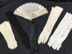 A box containing a fan with mother of pearl sticks and silk painted with image of 