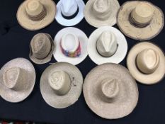 A box of sixteen hats, mainly straw, including panamas, etc.