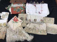A box containing a collection of modern and vintage textiles to include batik, wool embroidery,