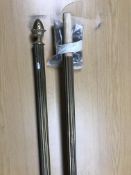 A brass fluted curtain pole with pineapple finials, joins in middle, each half being approx.