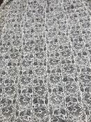 A pair of cotton blue and cream stylised flower decorated interlined curtains with fixed triple