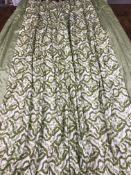 Two pairs of cotton curtains in a design of crumpled ribbon in green and cream with green edges,