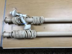 A reeded wooden curtain pole with finial and brackets, each pole excluding finials approx.