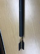 A black painted wooden curtain pole with arrow finials, pole approx.