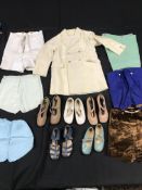 A box containing a large collection of early to mid 20th Century baby and young child clothes,