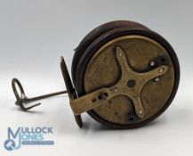 A scarce cone brass and mahogany star back reel, 3 3/8