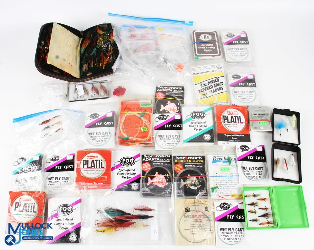 A quantity of fish fishing accessories, most of it looking unused, to include wet and dry fly cast