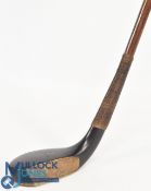 c1890 R Simpson of Carnoustie broad head long nose putter in dark stained beechwood, the hickory