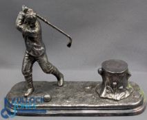A fine white metal Golfing Inkwell, early 20th century, in the form of a golfer about to hit a