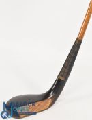 An A Patrick c1885 longnose dark stained beechwood putter the hickory shaft fitted with a full