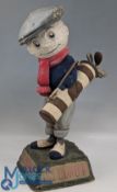 Original Dunlop Caddy Papier-Mache Golf Ball Advertising Figure on naturalistic base with 'We Play