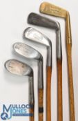 5x Spalding golf clubs all showing the hammer brand mark to incl a mid iron, mashie niblick, niblick