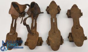 Two sets of vintage Roller Skates, one skate is missing a wheel, and one has a broken wheel