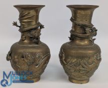 A pair of brass Chinese baluster vases, with raised entwined dragon decoration, 24cm high