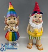 2x Garden Gnomes, a beach swinging ring and rubber duck gnome and a rainbow pride gnome made of