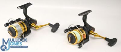 Pair of Penn Slammer 360 spinning reels, black/gold finish, folding handles, skirted spools, both in