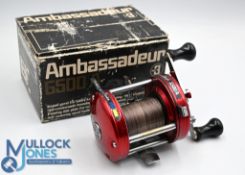ABU Ambassadeur 6500A multiplier reel in red finish, foot stamped 801000, high speed, twin handle,