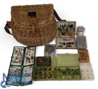 Contemporary fly fisher's creel with carry strap, holding a good collection of trout flies in boxes.