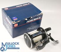 Penn 555 GS multiplier reel, star drag, free spool and ratchet, c/w some spare parts, papers, saddle