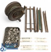 Period Fishing Reel and Tackle, a wooden brass backed reel, wooden line winders, tin of ceramic