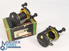 2x Abu Ambassadeur 6500 GR multiplier reels, graphite frame, twin handles with magnetic braking