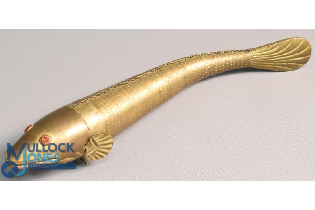 Vintage Medina pattern brass articulated fish 10" in length with red paste eyes, complete example