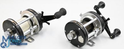 Pair of Abu Garcia Ambassadeur 6001C, LHW multiplier reels, one fitted with rubber grips, both
