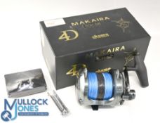 An Okuma Makaira 3011SE big game multiplier reel, lever drag with preset, free spool, power