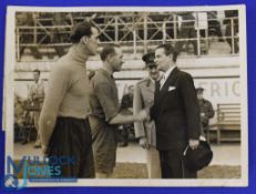 1945 b&w photograph featuring Matt Busby accompanied by Frank Swift (goalkeeper) shaking the hand of