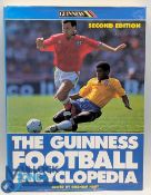Guinness Football Encyclopaedia signed by George Best - in front cover, with another unidentified