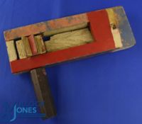Early 1950s an original Football Rattle in hardwood and painted in red and white with a hint of blue