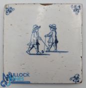 Golfing interest: a Delft blue and white tile, painted with two figures holding clubs or kolve, late