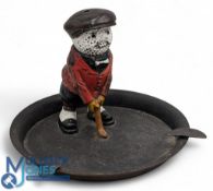 Dunlop golf ball advertising ashtray, a cast metal cold coloured figure with golf ball head - with