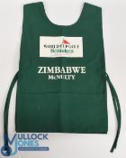 Mark McNulty (b.1953) signed Caddie Bib - Zimbabwean-Irish Professional Golfer. The bib in green,