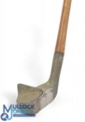 Unusual alloy mallet head putter with raised central crown fin and central metal ace insert