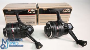 A pair of Abu Diplomat 844M close faced graphite reels, side roller tensioners, both with spare