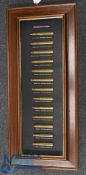 c1890-1920 African heavyweight Hunting Gun Cartridge Display, 13 brass cartridges with makers of