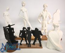 Collection of Art Sculptures featuring the Female and Male forms mounted on wooden bases tallest