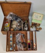 Four vintage wooden boxes holding a good collection of fly-tying materials, feathers, silks,