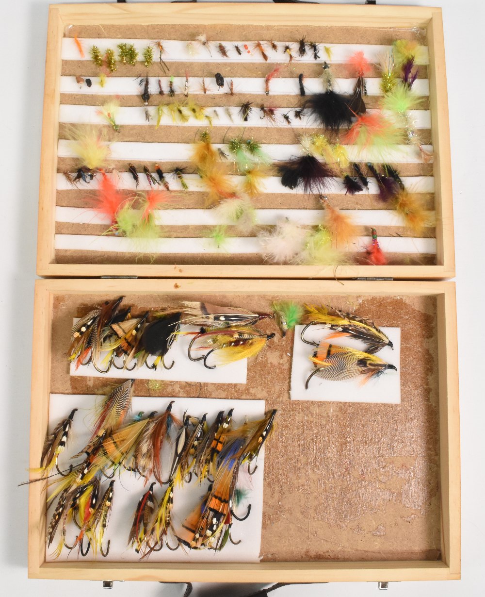 Wooden fly reservoir containing some massive traditional salmon flies, up to 3" long, various
