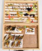 Wooden fly reservoir containing some massive traditional salmon flies, up to 3
