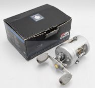 ABU Ambassadeur ProMAX 6600 multiplier reel in silver and grey finish, foot stamped 030003, star