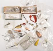 Large collection of assorted metal lures, including a 2