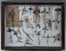 Display of 22 Bait Mounts in display case. Including 6 on original cards, 3 Alcock's 