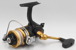 Penn Graphite 4400SS saltwater spinning reel, skirted spool, front drag, screw fold handle, very