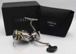 Shimano Stella 4000J Japan spinning reel foot stamped 03808, with spool 4000MHG, appears with little
