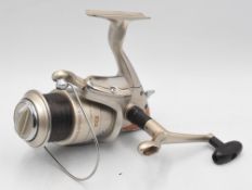 Tica Aries GR4000H fixed spool reel with folding handle, bail arm, rear brake adjuster, appears