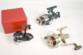 Daiwa Harrier Z 450A rear drag reel, an Intrepid Elite vintage spinning reel in maker's plastic