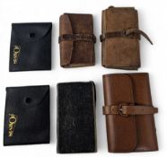 Collection of leather and pigskin vintage fly wallets, including a lightly used example with