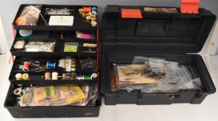 2x cantilever boxes stuffed with a quantity of fly-tying materials, including feathers, silks, wool,